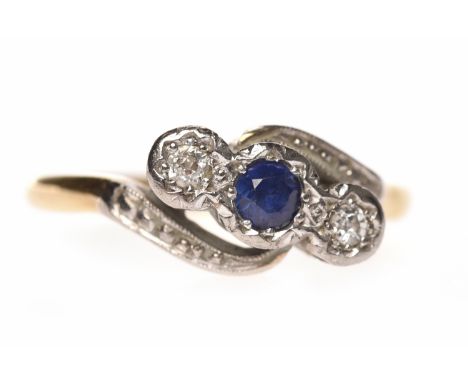 MID TWENTIETH CENTURY SAPPHIRE AND DIAMOND THREE STONE RINGset with a central round sapphire flanked by two round diamonds, i