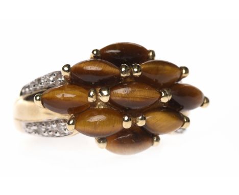 TIGER'S EYE AND DIAMOND DRESS RINGthe rhombic bezel formed by marquise shaped sections of tiger's eye, on diamond shoulders, 