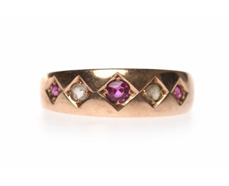 VICTORIAN FIFTEEN CARAT GOLD RUBY AND DIAMOND SET BANDthe band of tapered form and set with three graduated rubies interspace