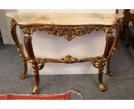 A Giltwood &amp; Marble Topped Serpentine Console Table, raised on four foliate scroll cabriole legs and stretcher, 115cm by 