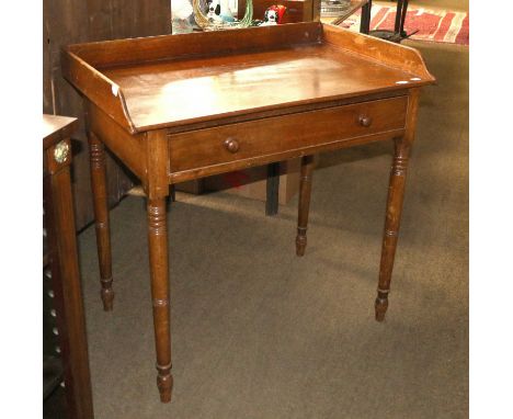 A Mid Victorian Mahogany Washstand, with single drawers and ring turn supports, 93cm by 58cm by 90cm