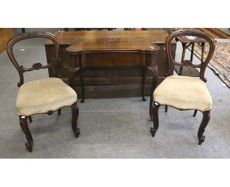 A Georgian Mahogany Fold Over Card Table, on scroll carved cabriole supports, 81cm by 41cm by 73cm; together with a pair of V