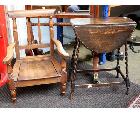 A Child's Oak Commode Chair, moulded top-rail above spindle back, shaped arms, solid removable seat, turned front legs, 37cm 