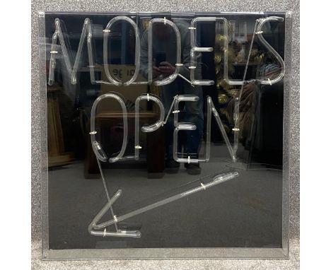 A vintage neon 'Models Open' sign mounted with black background in a perspex box, from God's Own Junkyard. H.92 W.92 D.12cm.