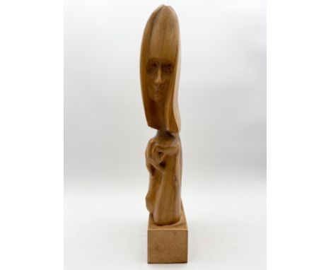 A mid-century carved teak abstract figural sculpture on a plinth base by Robert De Quin, signed to the base and dated 1963. H