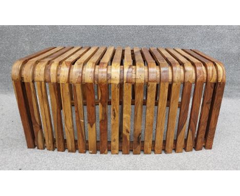 A mid-century Italian bent olivewood bench from a station waiting room in Bologna. H.48 W.98 D.60cm