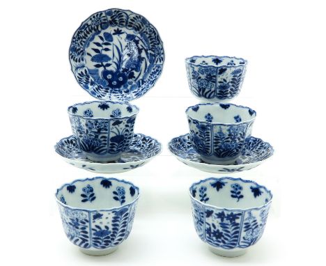 including 5 cups and 3 saucers, depicting flowers, scaloped edge, marked on bottom with double ring and a symbol, Kangxi, sau