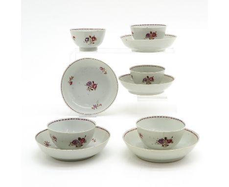 5 cups and saucers in polychrome floral decor, circa 1800, saucers are 14 cm. in diameter, chip and hairline.