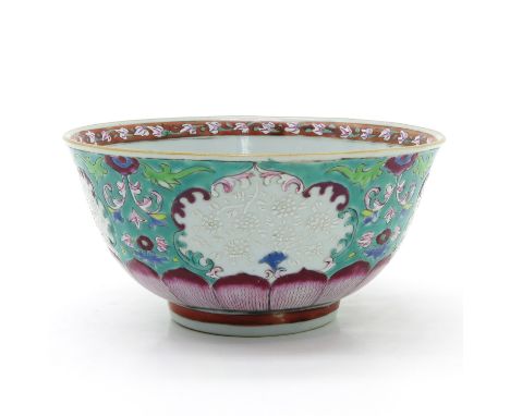 Light green ground with Famille Rose enamels, raised floral decor, Yongzheng, 18 cm. in diameter, hairline.