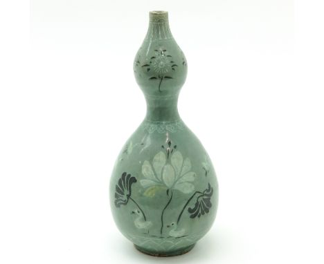 Light green ground with decor of flowers and birds, 30 cm. tall, crackle in glaze.