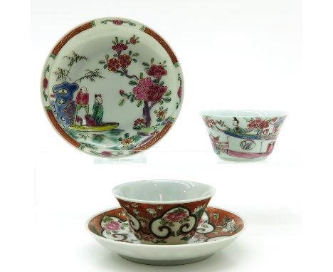 2 cups and saucers, including Famille Rose decor depicting man and woman in garden, saucers are 11 cm. in diameter.