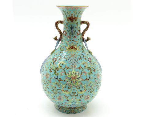 Light blue ground with Famille Rose and gold gilt enamles, marked on bottom with seal mark, 32 cm. tall.