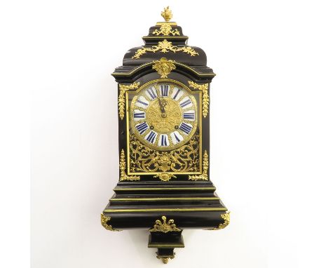 Black cabinet with gold gilt ornamental stand on console, with quarter and 1/2 hour, 2 bells and repetition  work, gold gilt 