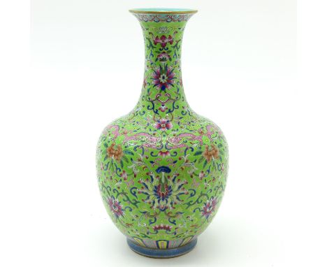 Light green ground with floral Famille Rose enamels, marked Qianlong, 31 cm. tall.