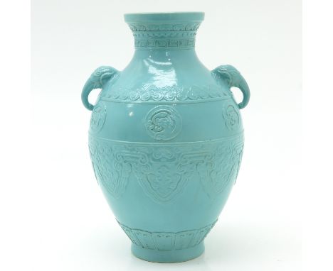 Light blue glaze, handles depicting elephants, marked on bottom with incised seal mark, 27 cm. tall.
