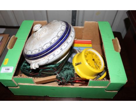 A box containing a tureen and cover, an alarm clock, a ladies evening purse etc. 