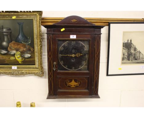 An early 20th Century mahogany cased wall clock 
