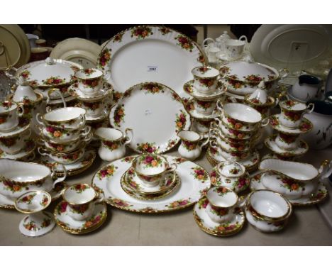A comprehensive Royal Albert Old Country Roses tea and dinner service comprising vegetable dishes and covers, tea pot, coffee