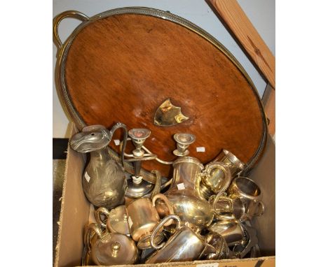 An Edwardian oval two handled tray, EPNS mounted; an electroplated four piece tea service; an EPNS table candlestick; a Victo