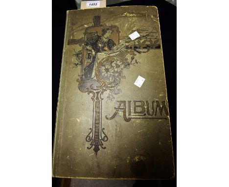 An Edwardian postcard album, Art Nouveau style design containing 304 postcards, actresses, topographical, humorous etc