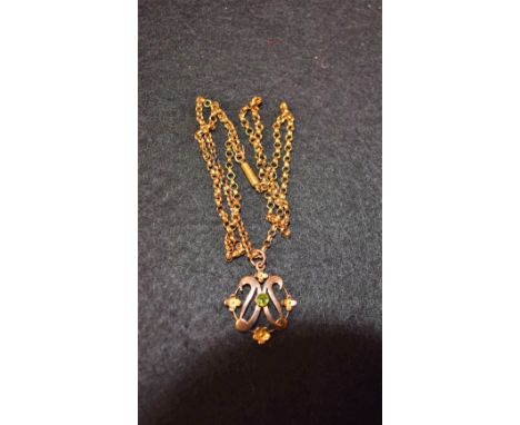 An Art Nouveau 9ct gold and peridot pendant on 9ct belcher chain