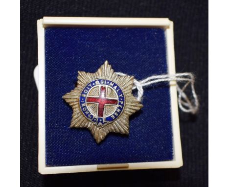 A silver and enamel badge, Latin inscription