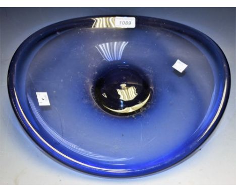 Per Lutken for Holmgaard - a blue glass dished oval bowl, raised centre, signed