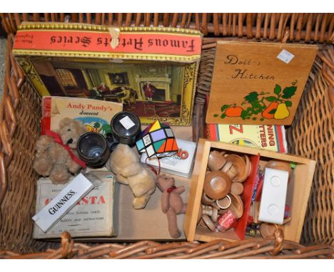 A wicker picnic hamper; binoculars; games, miniature treen doll's kitchen set in wooden box, playing cards; miniature bears; 