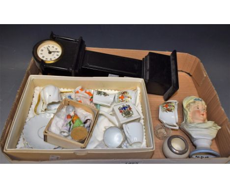 A 1930s pincusion doll, three others; a miniature ebonised longcas clock; a novelty table vesta, enamelled with playing cards