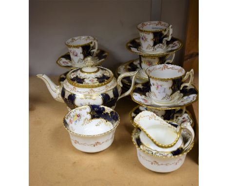 A Coalport tea service, cobalt blue and gilt border, floral decoration, teapot, six cups, saucers, side plates, two bowls, cr