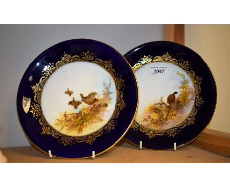 A pair of Royal Worcester plates, Partridge and Pheasant, signed G Johnson