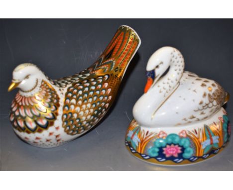 A Royal Crown Derby paperweight, Swan, gold stopper, boxed; another, Turtle Dove, gold stopper, boxed (2)