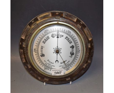 An oak cased aneroid barometer