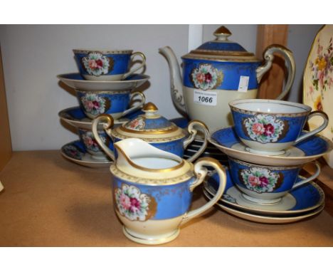 A Japanese export Crown China tea set comprising, teapot, sucrier, cream jug, five cups, six saucers, six tea plates