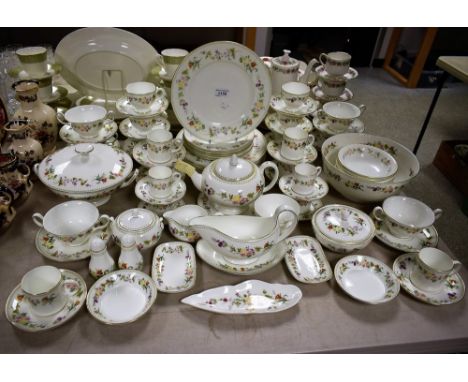 A comprehensive Wedgwood Mirabelle pattern dinner service, comprising dinner plates, serving plates, sauce boat, vegetable di