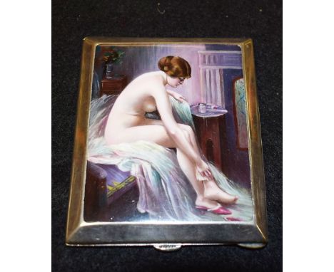 An Edwardian style rounded rectangular silver colour metal cigarette case, the cover panel painted with a female nude in boud