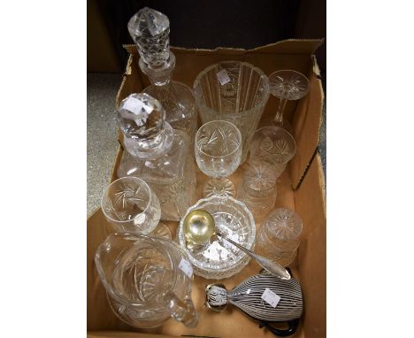 Glassware - a square cut crystal decanter; a cylindrical cut crystal decanter; a cut glass vase and jug; a glass cat paperwei