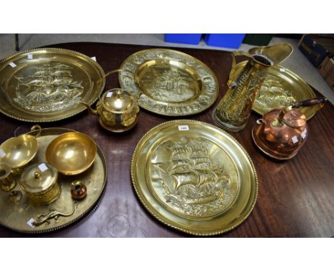 A copper kettle; a brass kettle; assorted brass chargers; an embossed brass jug; brass caddy; sauce boat; etc