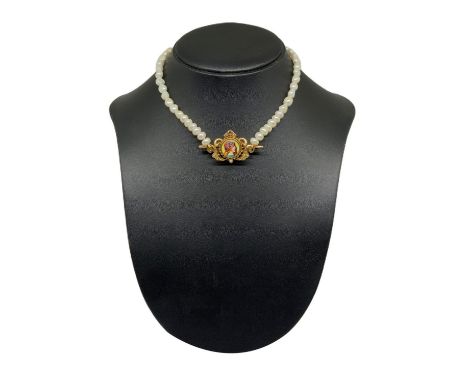  In antique gold with woman figure on enamel 