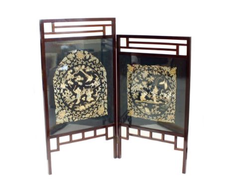 An Anglo-Chinese silkwork mahogany framed two-fold fire screen, 19th century, the frame with openwork fret friezes in the aes