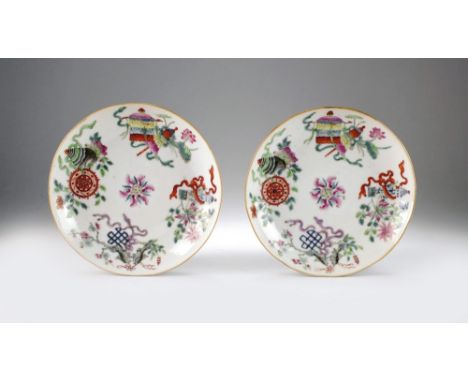 A pair of Chinese famille rose saucers, Xiangfeng seal marks and of the period, of plain circular form and painted in colours