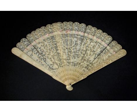 A Chinese Canton ivory brise fan, Qing, 19th century, the twenty-two stick fan finely carved on one side with a densely popul