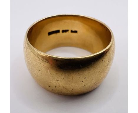 A substantial yellow metal ring, stamped "9ct". Gross weight approximately 15.8 grams. Size U.&nbsp;