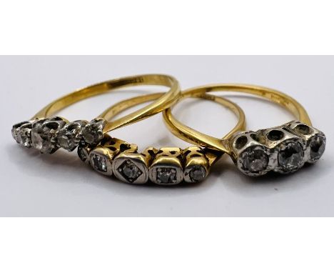 A set of three early 20th century diamond set rings. One a three stone diamond ring, size K;&nbsp; a five stone Art Deco ring