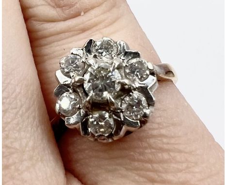 A raised diamond cluster ring in 18ct yellow gold. Estimated total diamond weight 0.50cts. Size L1/2. Gross eight approximate