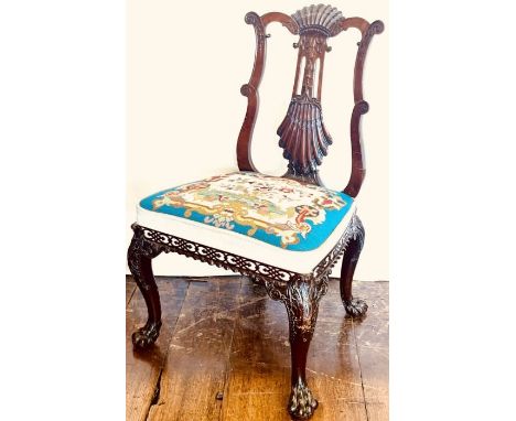 A George III mahogany chair in the Chinese Chippendale manner, circa 1770 and later, scrolling serpentine backrest with a pie