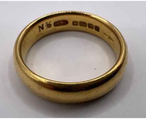 A 22ct gold band ring. Approximate weight&nbsp; 8.1 grams. Size N.