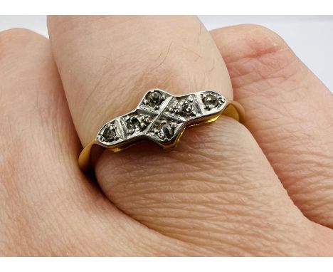 An Art Deco diamond set panel ring, in yellow metal, stamped "18ct + Plt". Approximate weight 2.3 grams. Size O.&nbsp;