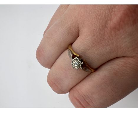 A yellow metal solitaire ring,circa early 20th century. Round brilliant cut diamond, estimated weight 0.15ct. Marked 18ct. Fe