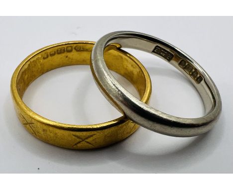 Two gold rings - comprising a white 18ct gold band ring, approximate weight 3.0 grams, size J1/2; and a decorated 22 ct gold 